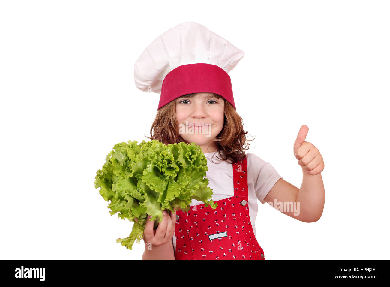 little cook with fresh green salad and thumb up Stock Photo