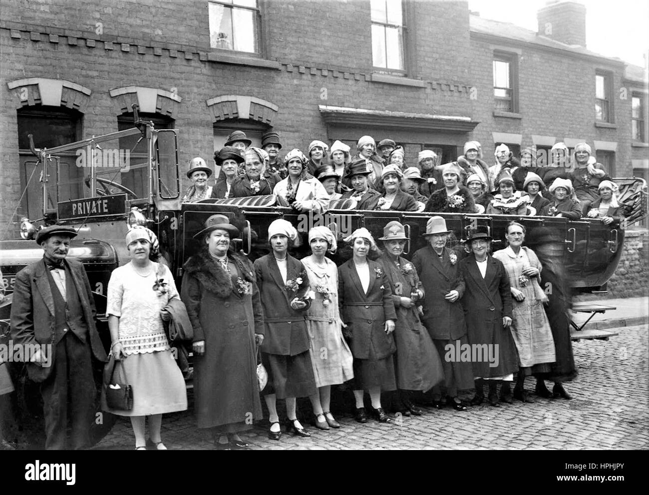 Female workers from the Adams & Company lace making factory in Stoney Street, Nottingham, aboard a charabanc for their annual day out in 1927. Stock Photo