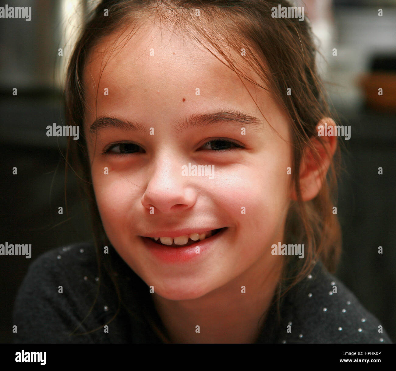 young girl smiling at camera Stock Photo - Alamy