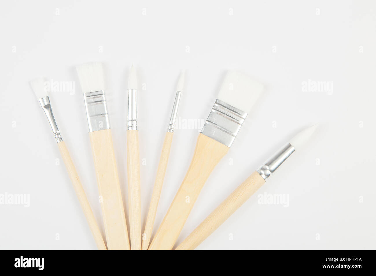 White paintbrushes with wooden handle on clear background Stock Photo
