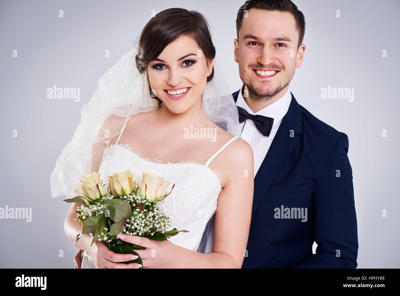 Portrait of young and cheerful just married couple Stock Photo - Alamy