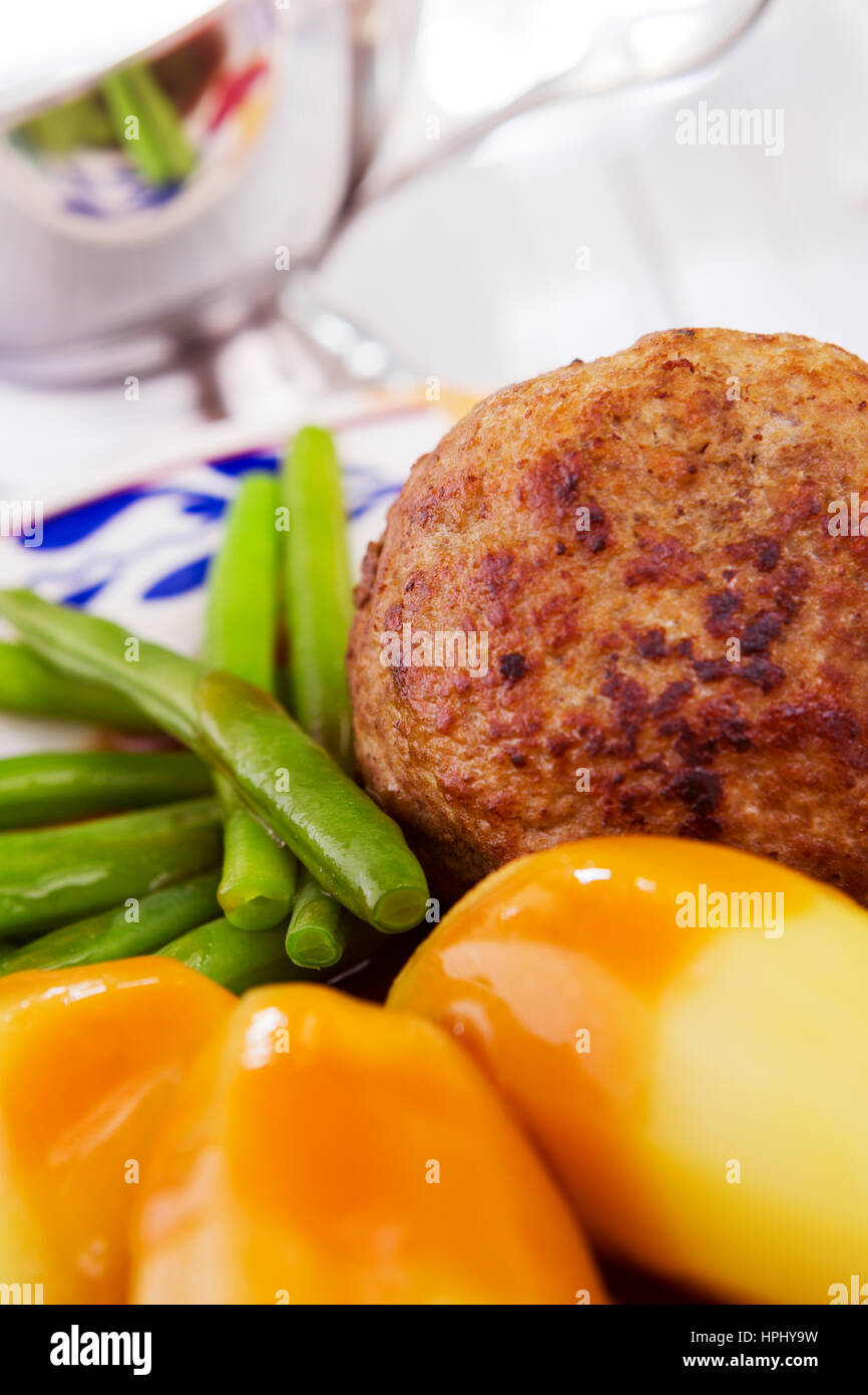 A plate with potatoes, meat and vegetables; a typical Dutch meal at dinnertime. Stock Photo