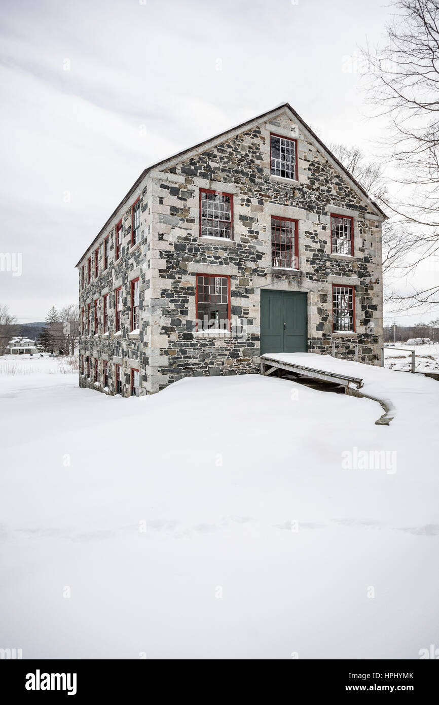 An old stone barn in winter at the Shaker Village, Enfield, NH Stock