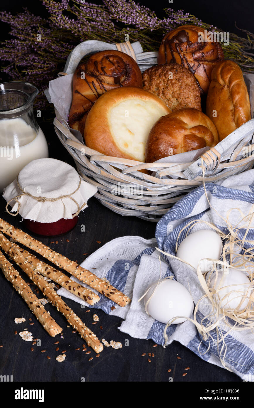 Bakery counter with variety of sweet pastry with cottage cheese, jam