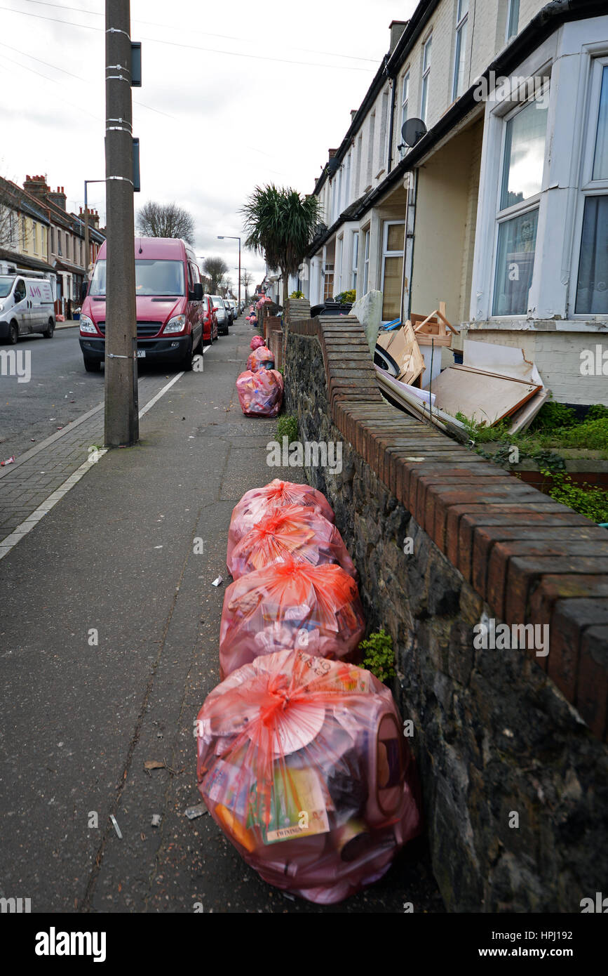 Recycling bags lined up outside houses on Hainault Avenue, Westcliff on