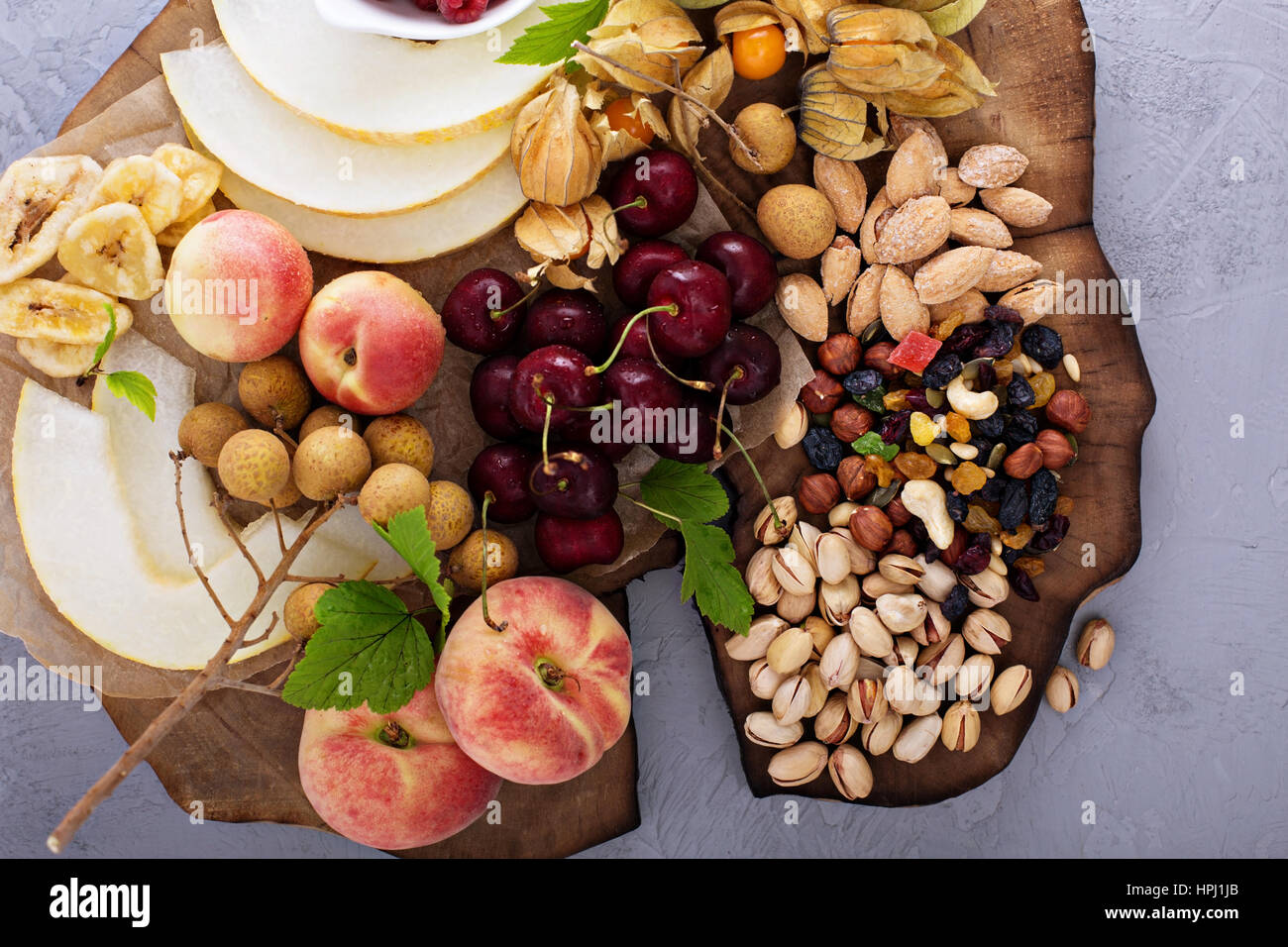 Fresh fruit and nut platter with cherry, peaches and trail mix Stock Photo Alamy