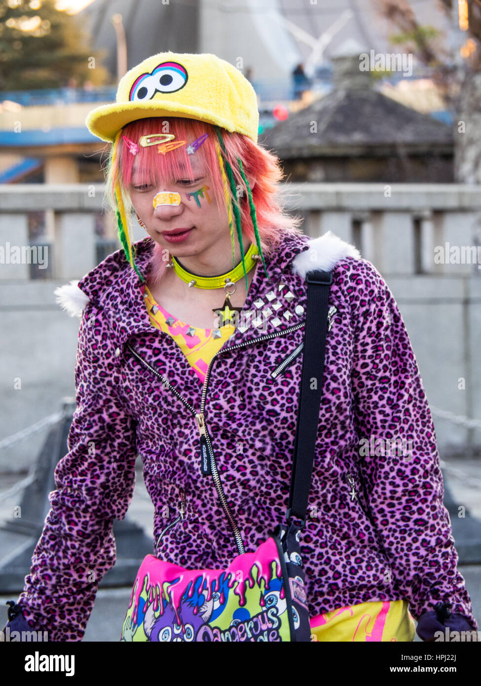 A young Japanese adult male dressed in stylized street fashion in Harajuku, Tokyo. Stock Photo