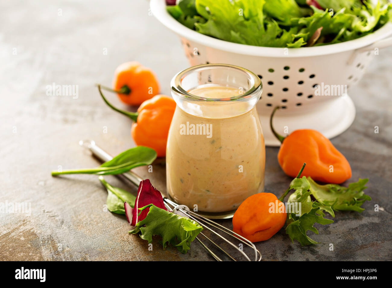 Sriracha ranch salad dressing with hot peppers Stock Photo