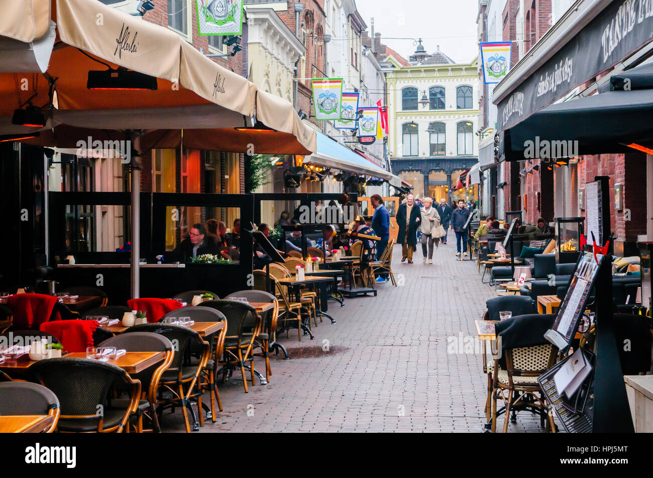 Cobbled street in 's-Hertogenbosch with restaurants and bars. Stock Photo