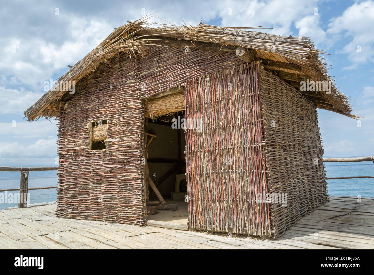 Reed house build on lake Stock Photo Alamy