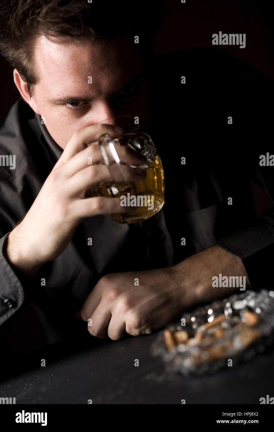 Model released , Mann trinkt Bier - man drinks beer Stock Photo