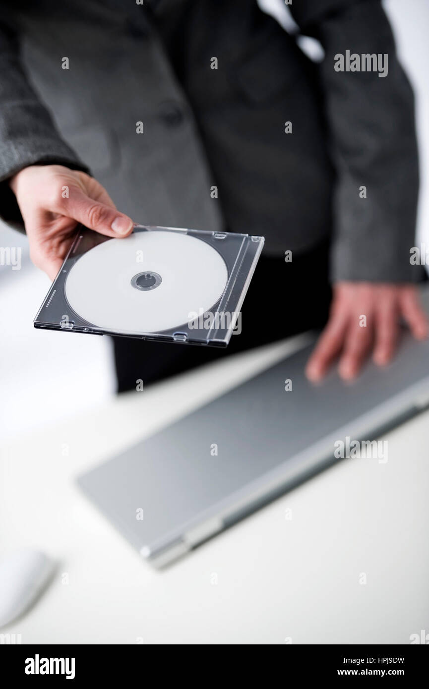 Model released , Geschaeftsfrau mit CD - business woman with CD Stock Photo