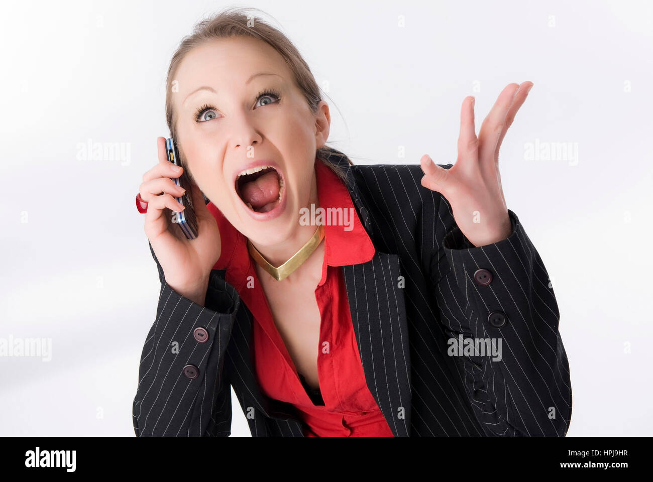 Model released , Schreiende Geschaeftsfrau mit Handy - Screaming business woman with mobile phone Stock Photo