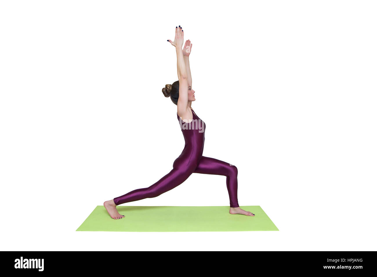 Young slim woman doing yoga exercise on mat isolated on white ...