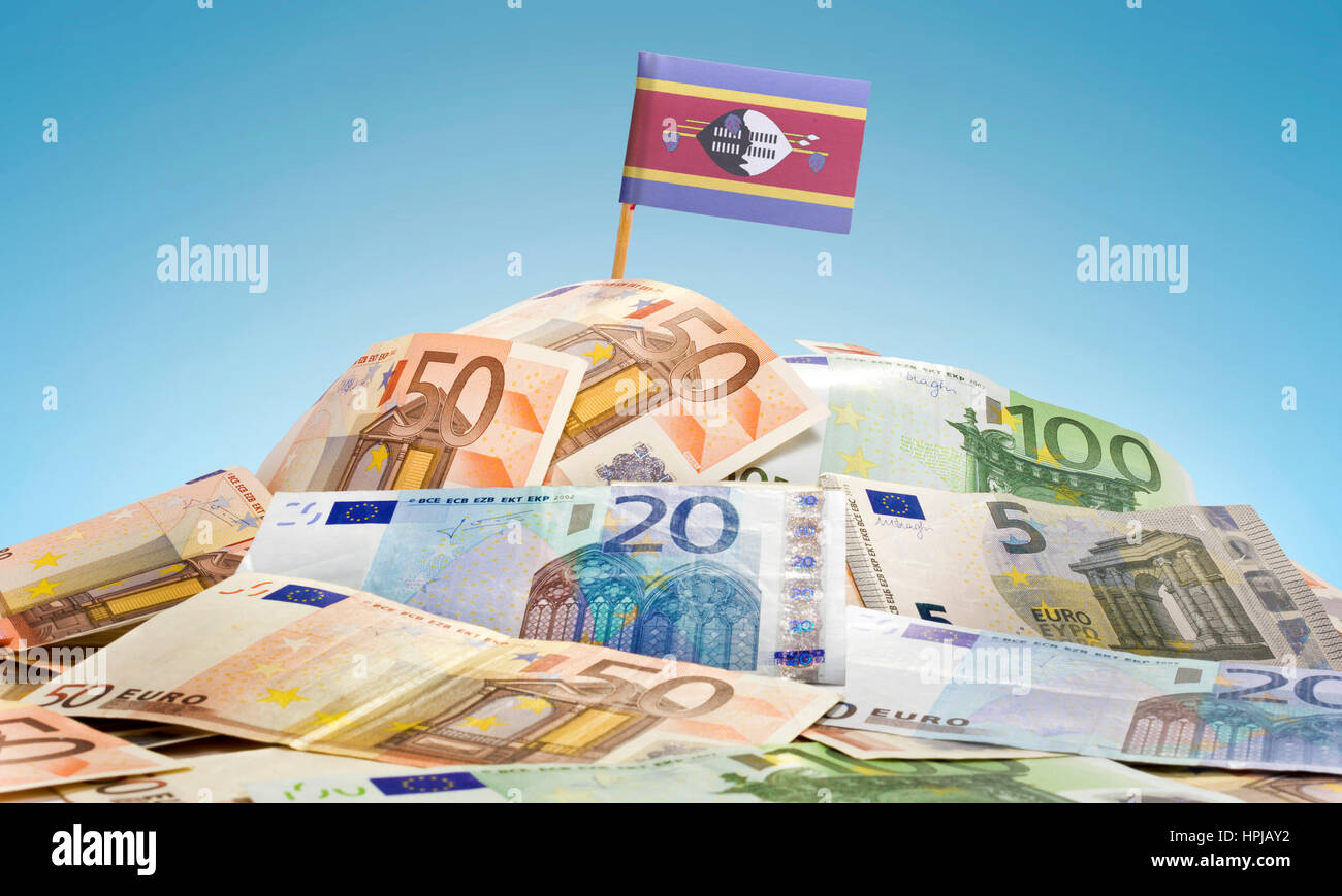 The national flag of Swaziland sticking in a pile of mixed european banknotes.(series) Stock Photo