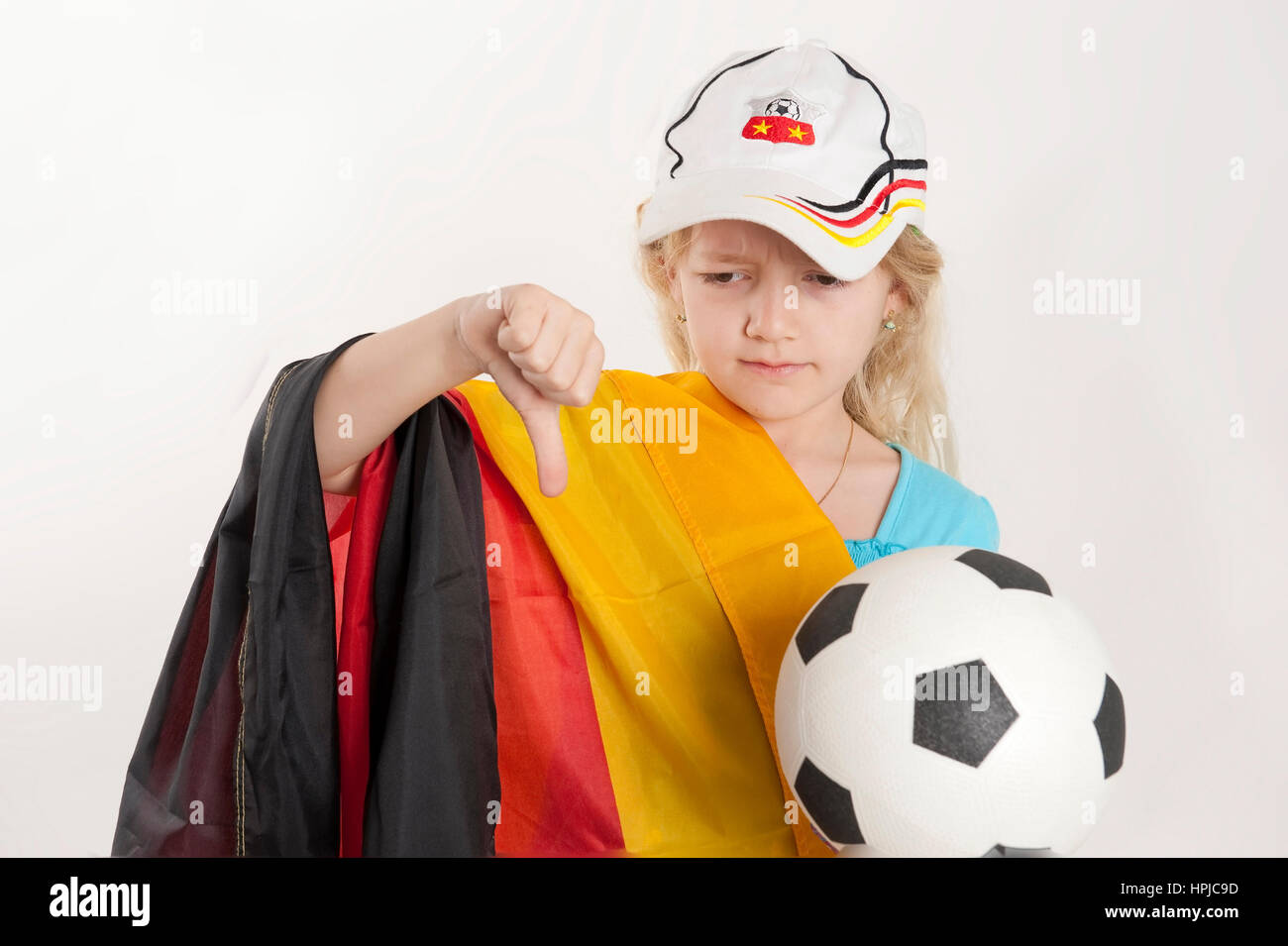 Model released , Enttaeuschtes Maedchen als Deutschlandfan, Fussballfan - soccer fan Stock Photo
