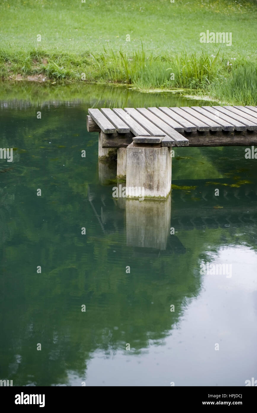 Steg am Teich bridge at pond Stock Photo Alamy
