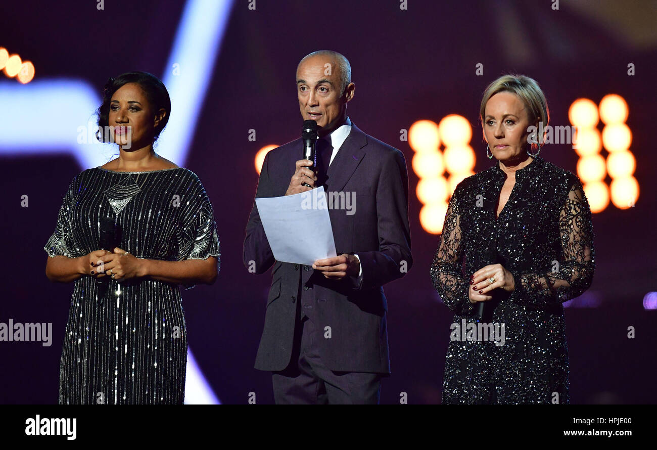 Helen Pepsi DeMacque, Andrew Ridgeley and Shirley Holliman give a tribute on stage to George Michael at the Brit Awards at the O2 Arena, London. Stock Photo