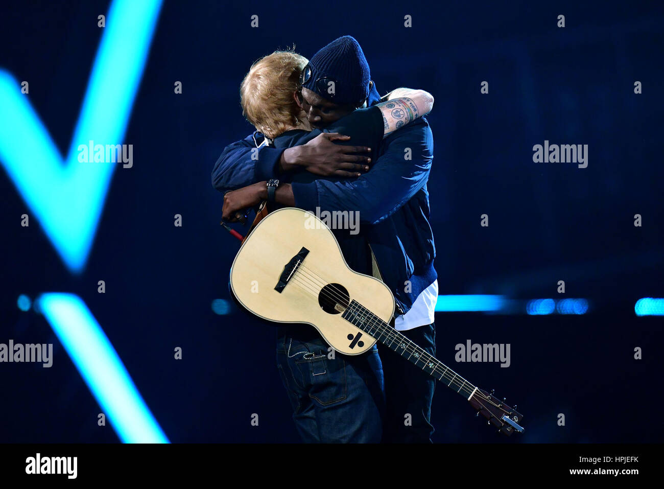 Ed Sheeran performing on stage at the Brit Awards at the O2 Arena ...