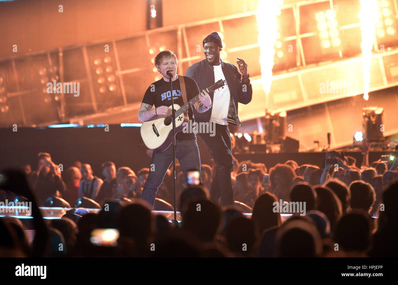 Ed Sheeran performing on stage at the Brit Awards at the O2 Arena ...