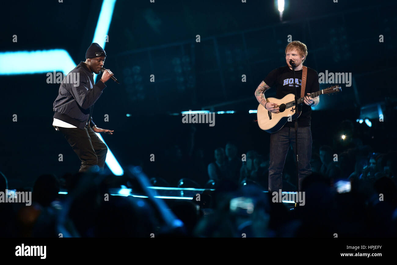 Ed Sheeran performing on stage at the Brit Awards at the O2 Arena ...
