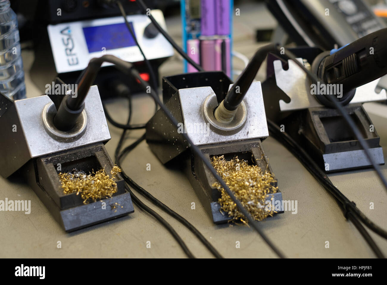 Soldering irons on stands Stock Photo