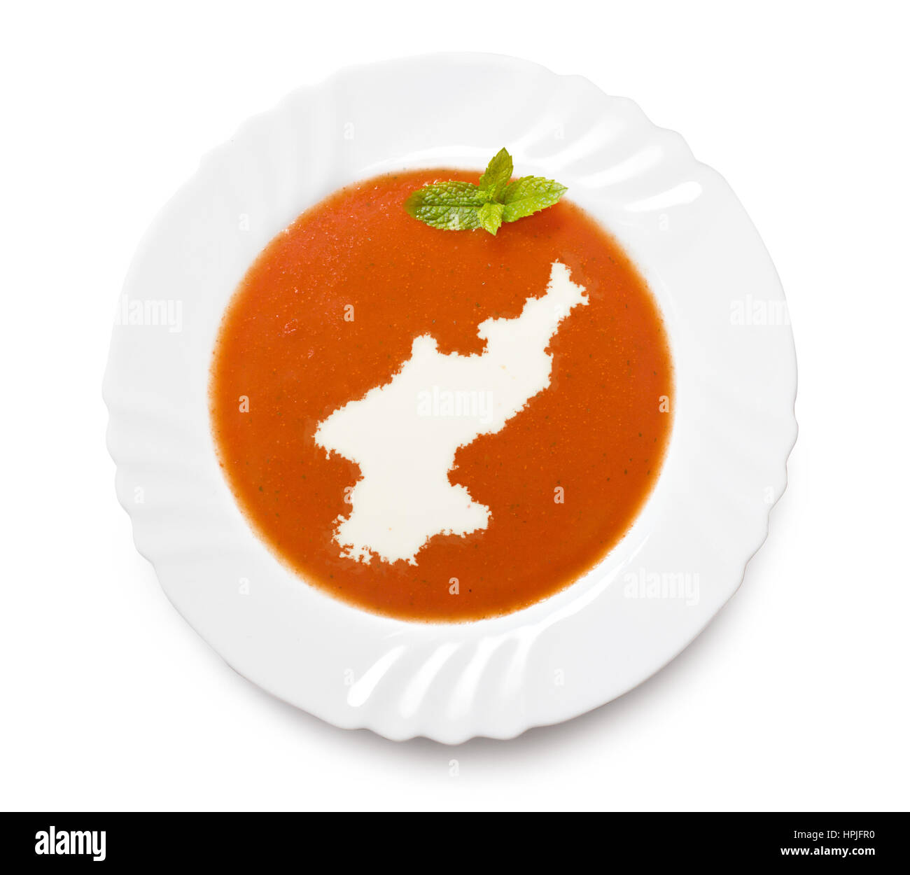 A plate tomato soup with cream in the shape of North Korea.(series