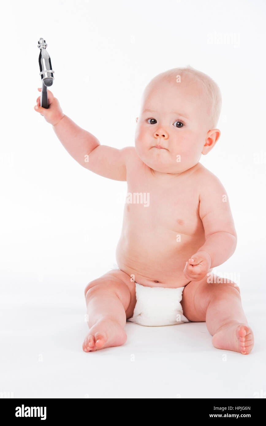 Model released , Baby, 10 Monate, mit Perkussionshammer - baby with reflex hammer Stock Photo