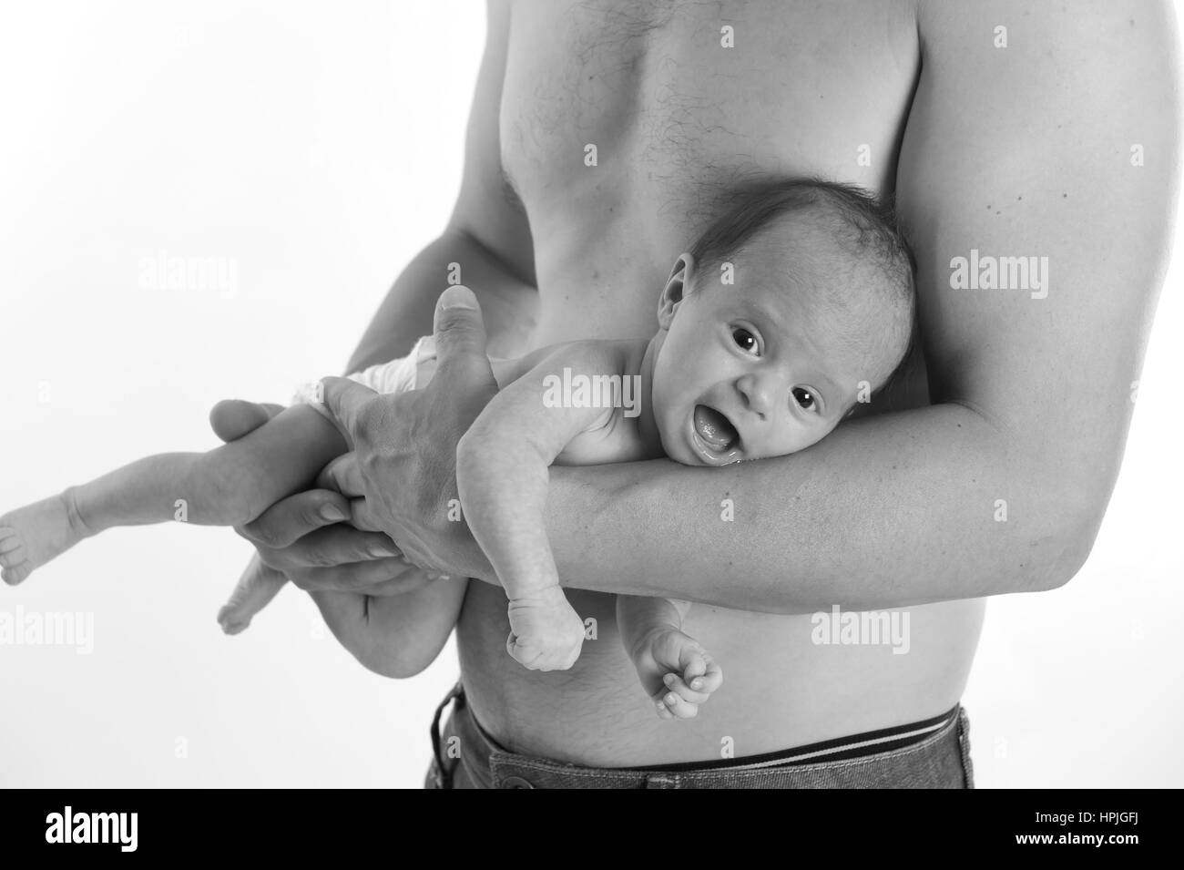 Model released , Vater mit Neugeborenem im Arm - father with baby Stock Photo