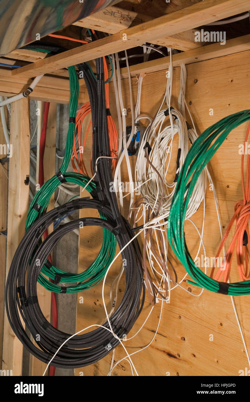 Assorted wires hanging from opened ceiling inside a home Stock Photo Alamy