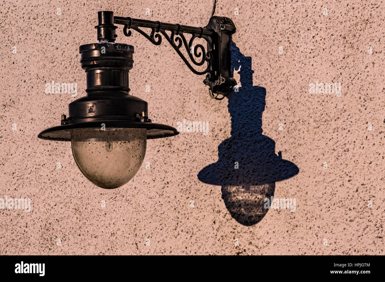 Lamp and shadow on the side of Meall House, next to the Skye Gathering Hall, Portree, Isle of Skye, Scotland Stock Photo