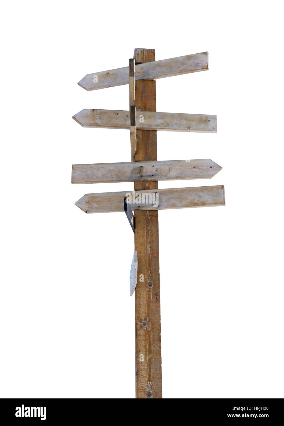 Old wooden arrow signpost against a white background with copy space. Idea of crossroads and concept of being lost, confused or indecisiveness. Vertic Stock Photo
