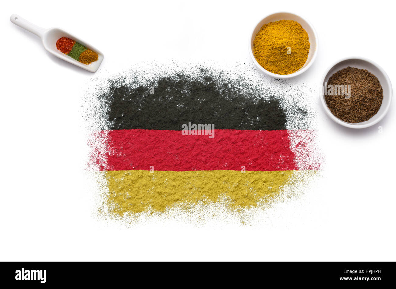 Various spices forming the flag of Germany.(series Stock Photo Alamy
