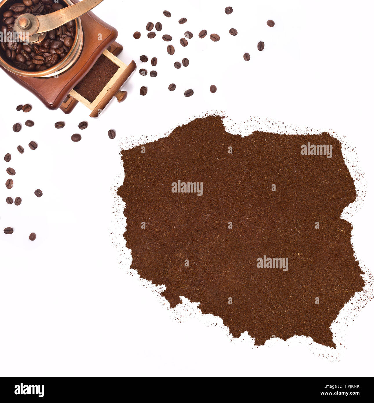Coffee powder in the shape of Poland and a decorative coffee mill