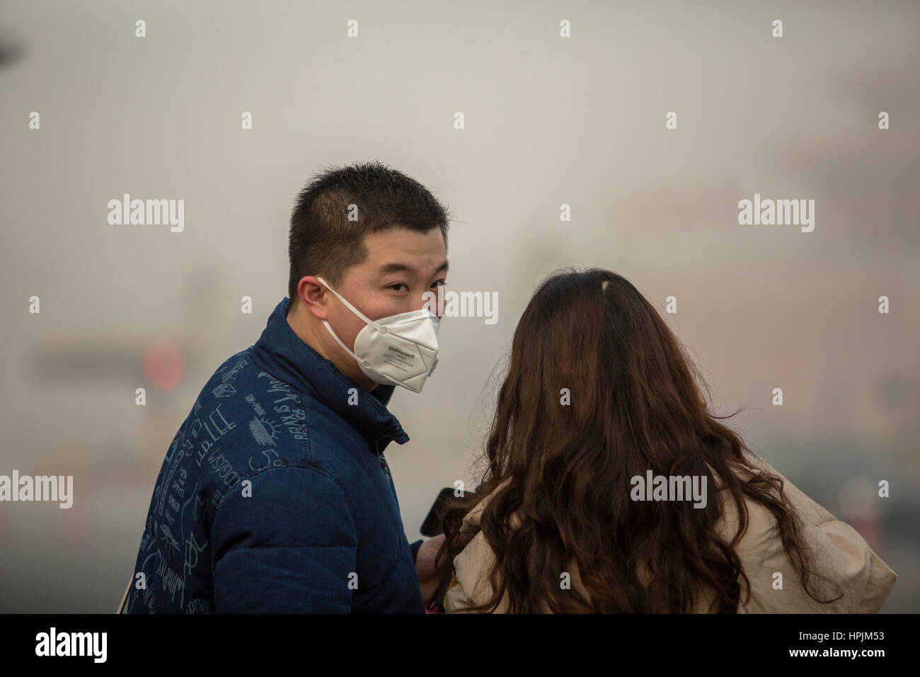 people wearing mask in heavy smog Stock Photo