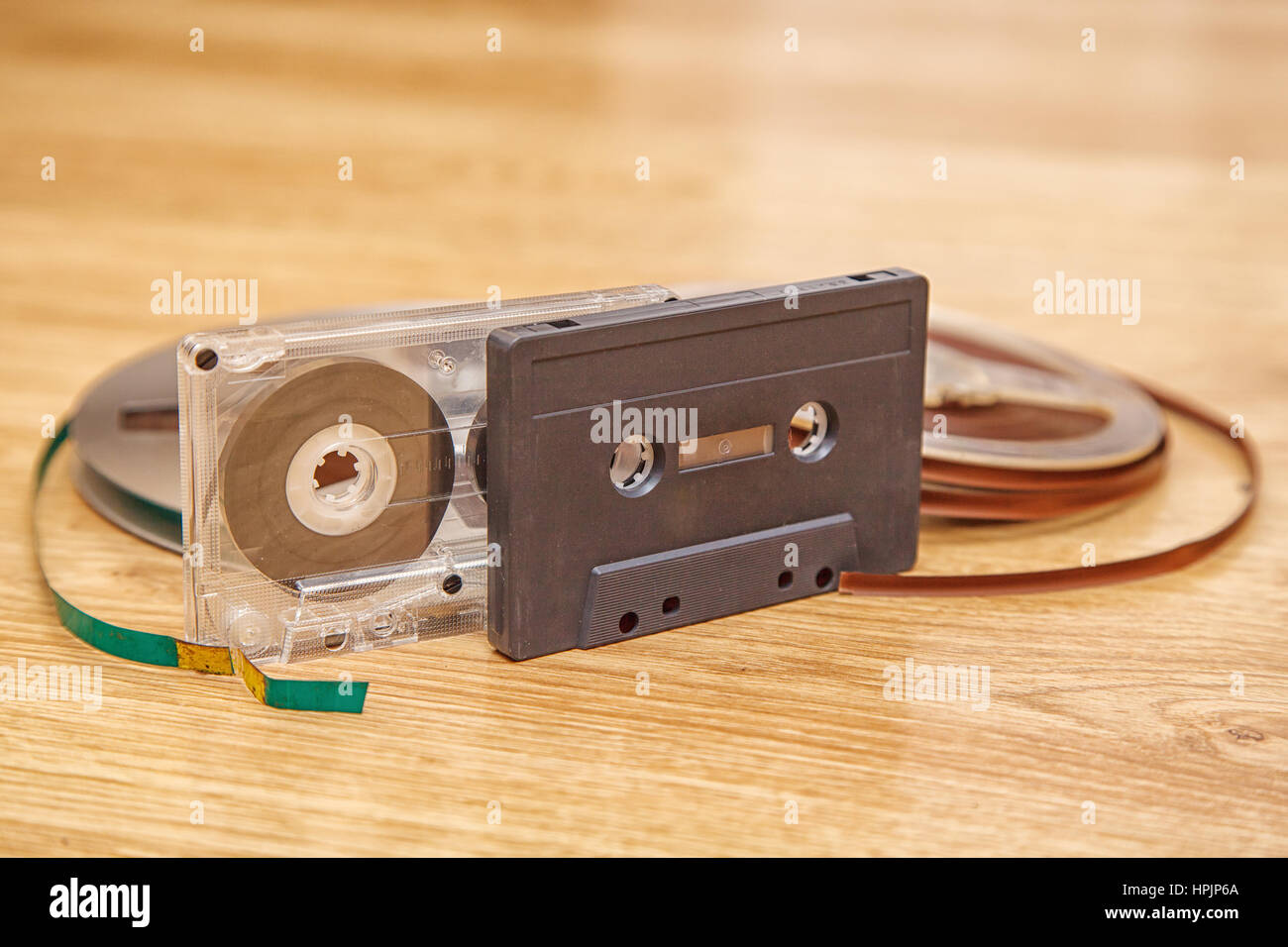 cassettes tape and reel lying on the floor closeup Stock Photo Alamy