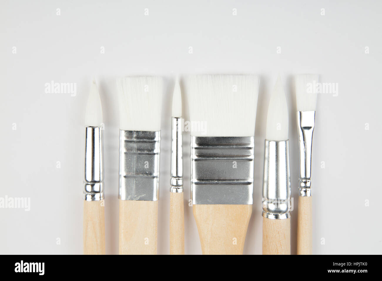 White paintbrushes with wooden handle on clear background Stock Photo