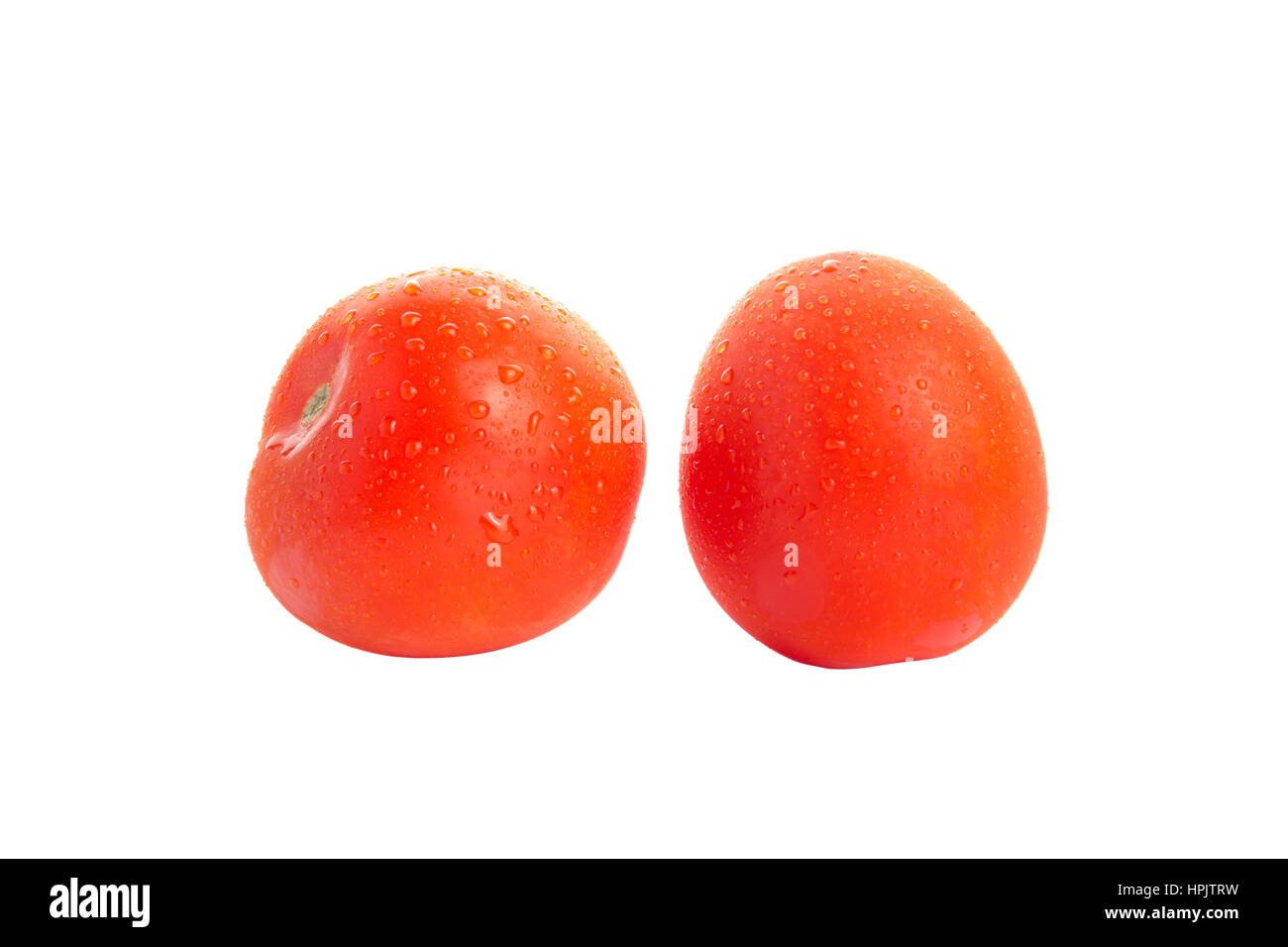Two red tasty isolated tomatoes on white background Stock Photo - Alamy