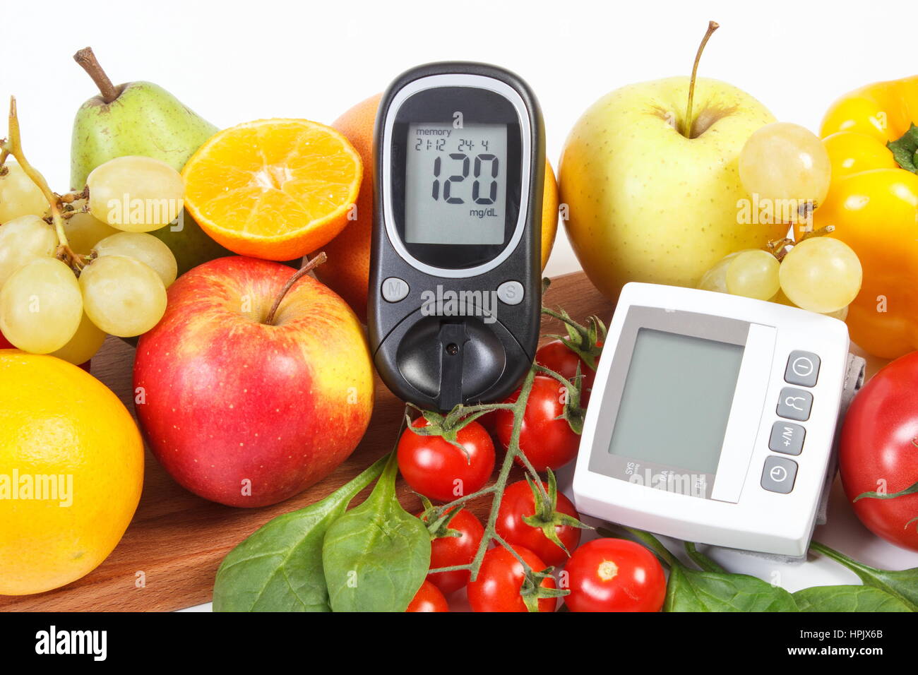 Glucose meter with result of sugar level, blood pressure monitor and fresh  fruits with vegetables, healthy lifestyle, diabetes and prevention of hyper  Stock Photo - Alamy