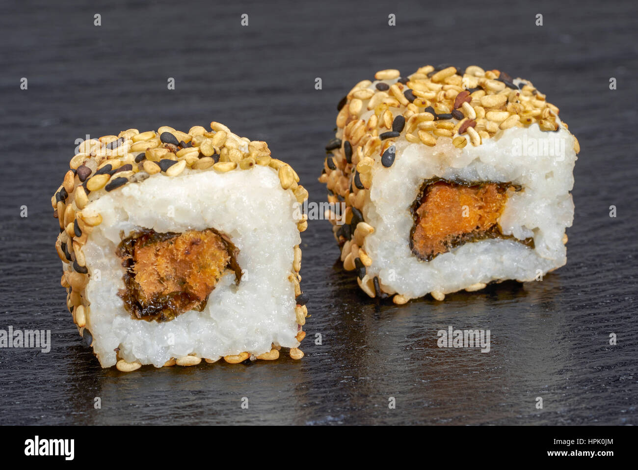 two sushi dish on dark grey stone surface Stock Photo