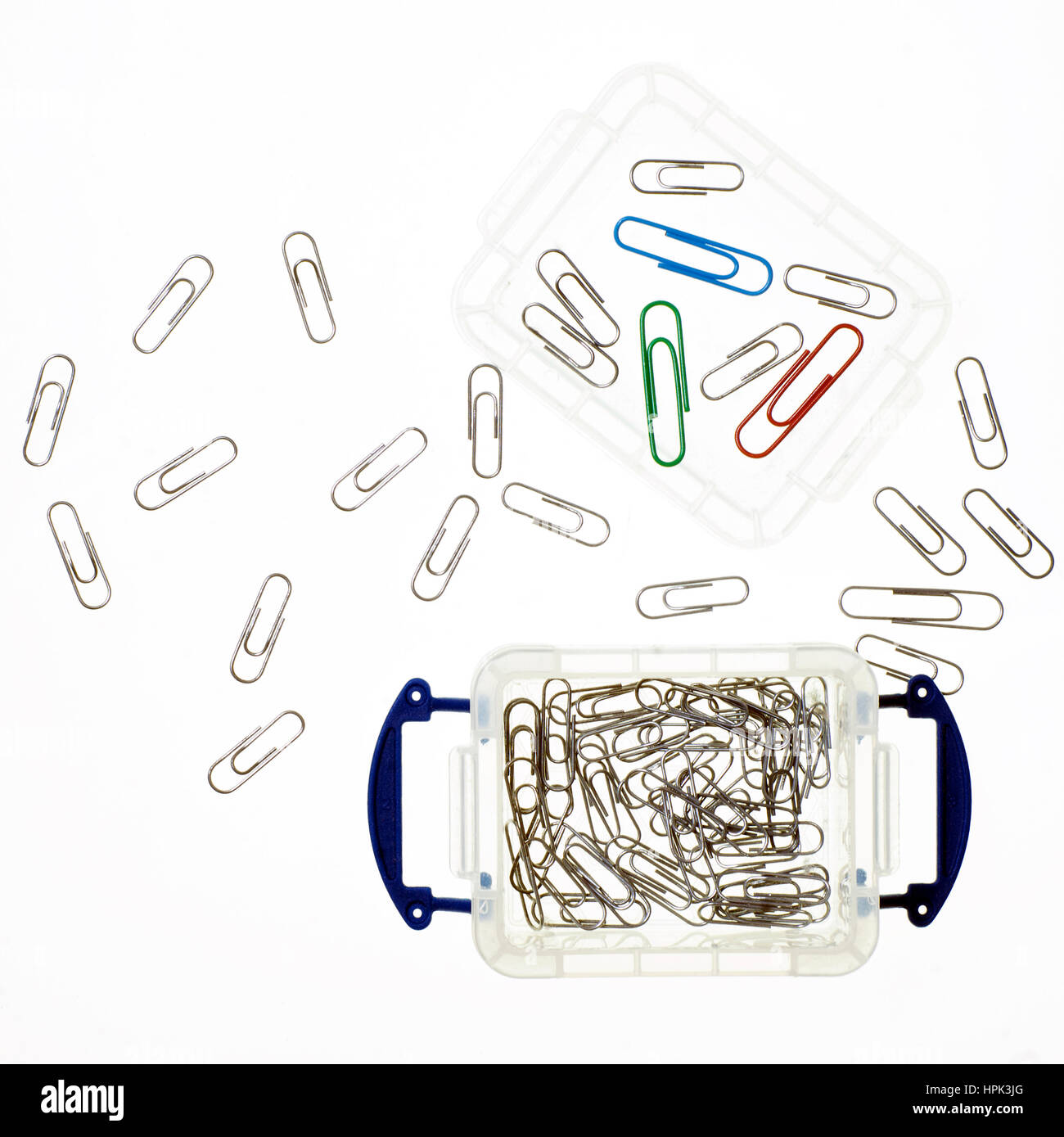 Plastic box containing paper clips Stock Photo