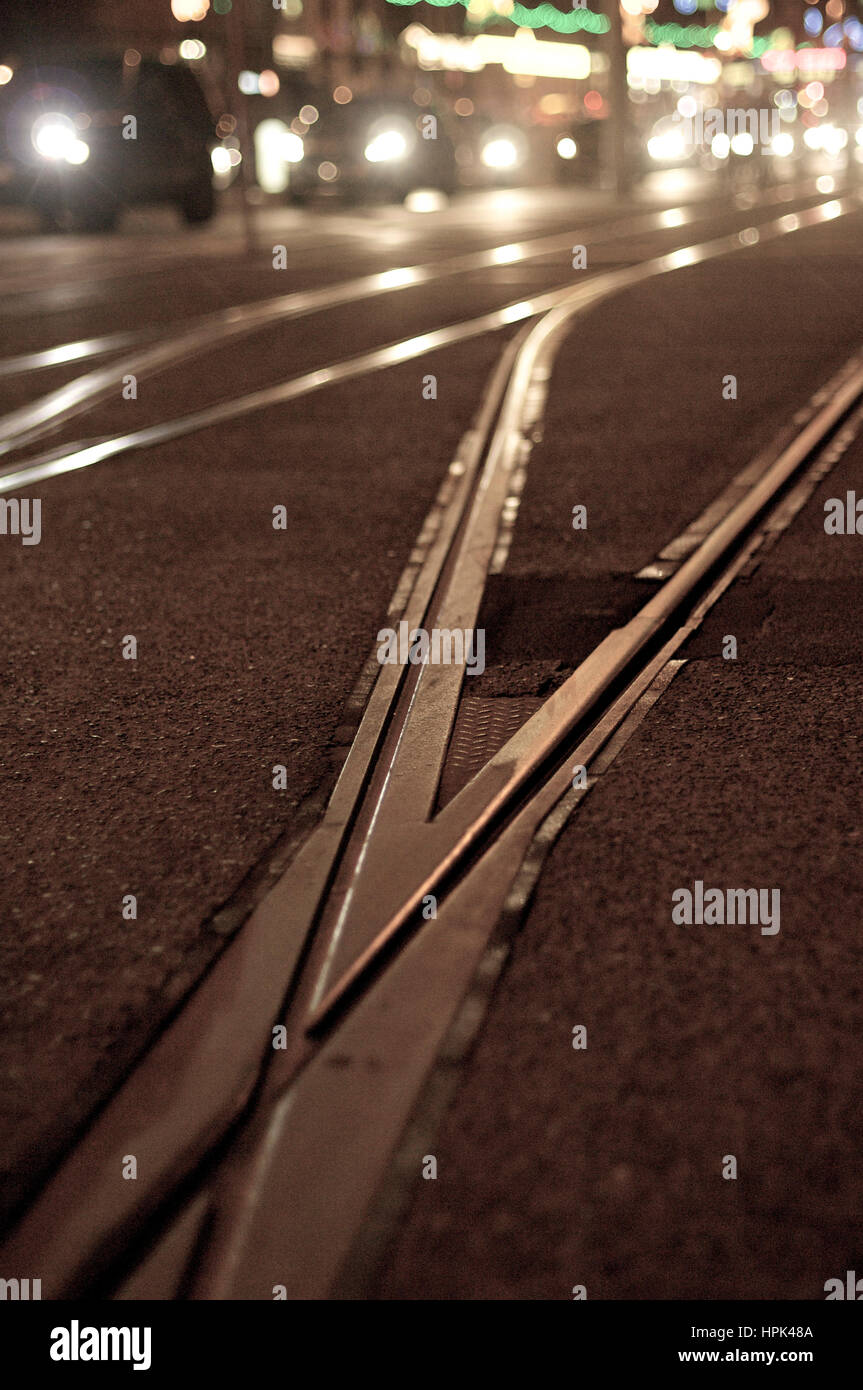 Tram track and traffic at night Stock Photo