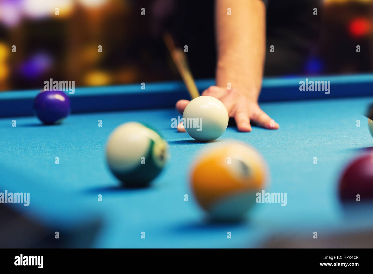 bar billiard hand aiming the cue ball Stock Photo Alamy