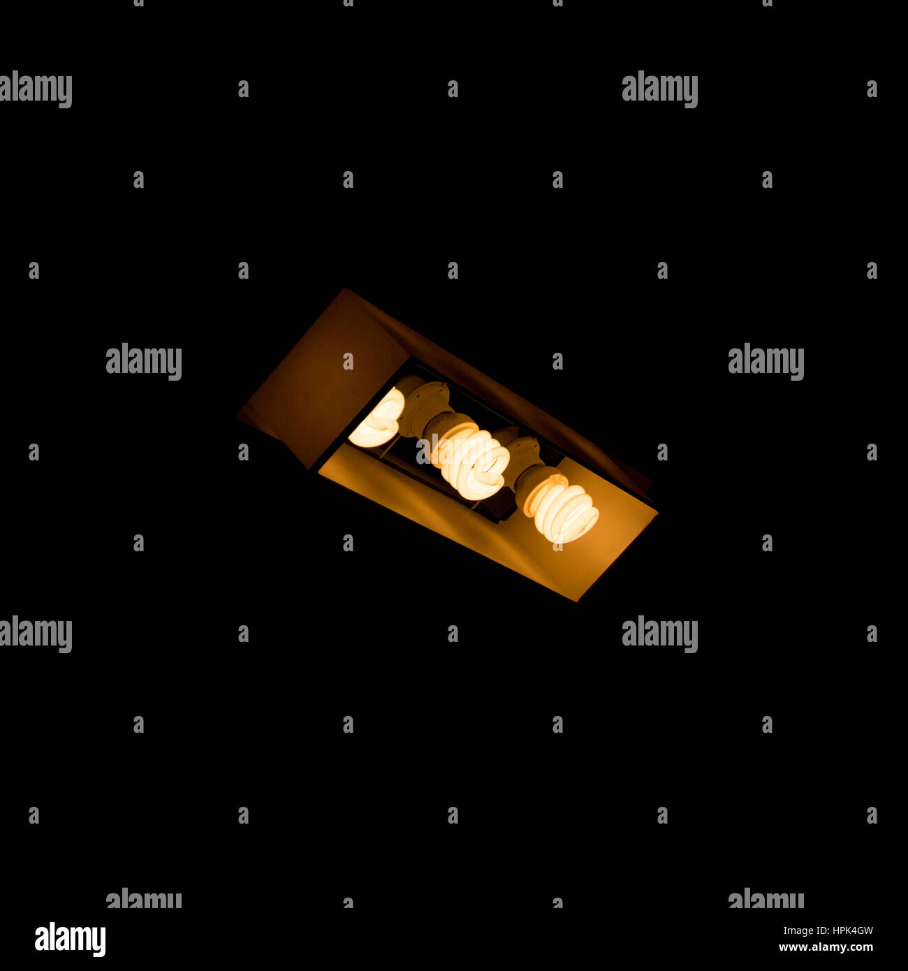 Three bulbs in lamp shade Stock Photo Alamy