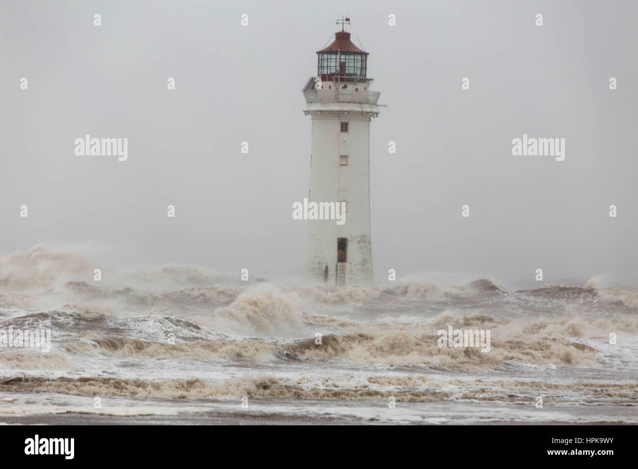New Brighton, UK. 23rd Feb, 2017. High winds from Storm Doris batter the coastline at New Brighton on the Wirrall in the North West of England today (Thursday 23rd February) Waves hit Perch Rock Lighthouse. Picture by Credit: Chris Bull/Alamy Live News Stock Photo
