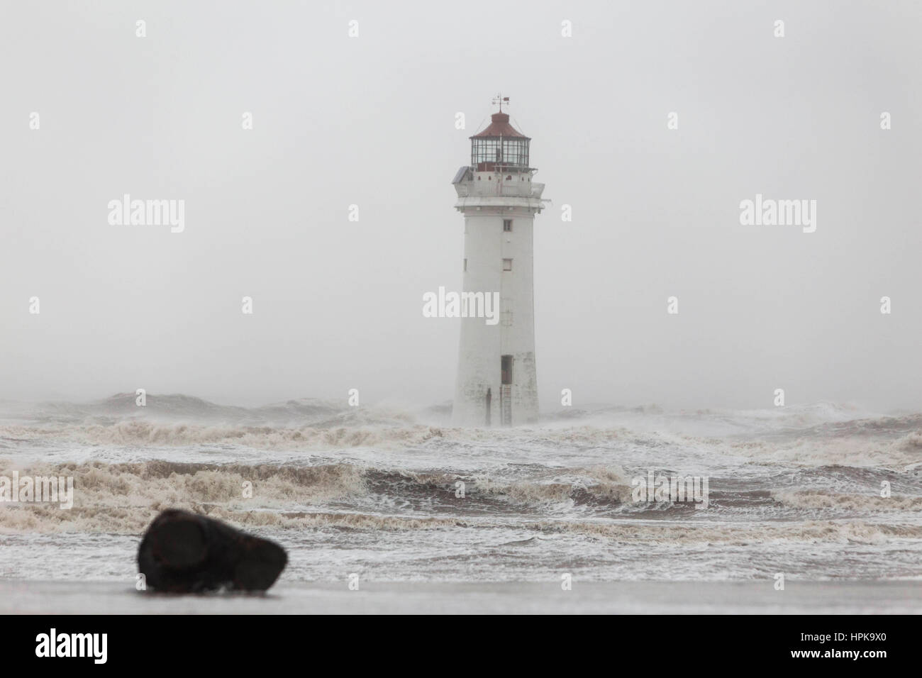 New Brighton, UK. 23rd Feb, 2017. High winds from Storm Doris batter the coastline at New Brighton on the Wirrall in the North West of England today (Thursday 23rd February) Waves hit Perch Rock Lighthouse. Picture by Credit: Chris Bull/Alamy Live News Stock Photo
