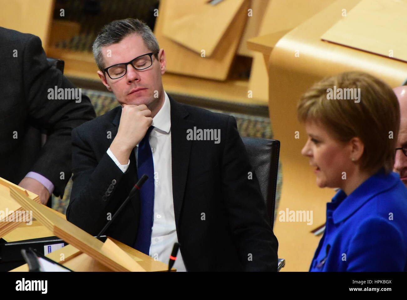 Edinburgh, Scotland, UK. 23rd February 2017. Finance Secretary Derek Mackay at First Minister's Questions in the Scottish Parliament, shortly before the Stage 3 (final reading) debate on the Scottish budget, Credit: Ken Jack/Alamy Live News Stock Photo