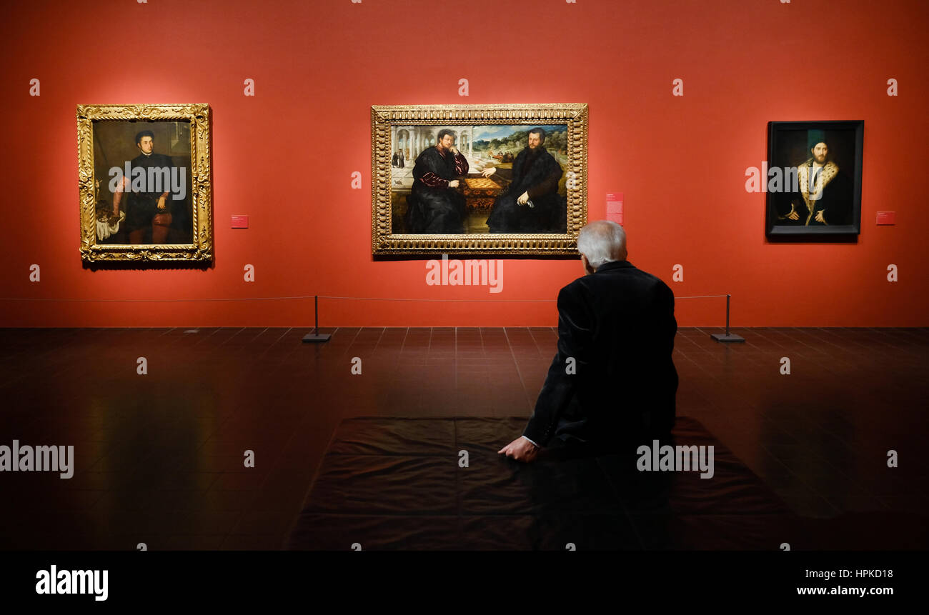 A man looks at works of art on display as part of an exhibition entitled 'The Poetry of Venetian Painting' in Hamburg, Germany, 23 February 2017. The exhibition will feature the work of artists such as Paris Bordone, Palma il Vecchio and Tizian. The show opens on the 24.02.17 and runs to the 21.05.17. Photo: Axel Heimken/dpa Stock Photo