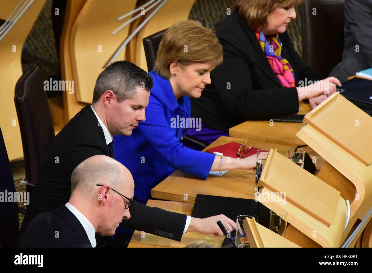 Edinburgh, Scotland, United Kingdom. 23rd February, 2017. Scottish Finance Secretary Derek Mackay (C)and First Minister Nicola Sturgeon (C) cast their electronic vote on the final stage of the Scottish budget, which the Government finally carried, Credit: Ken Jack/Alamy Live News Stock Photo