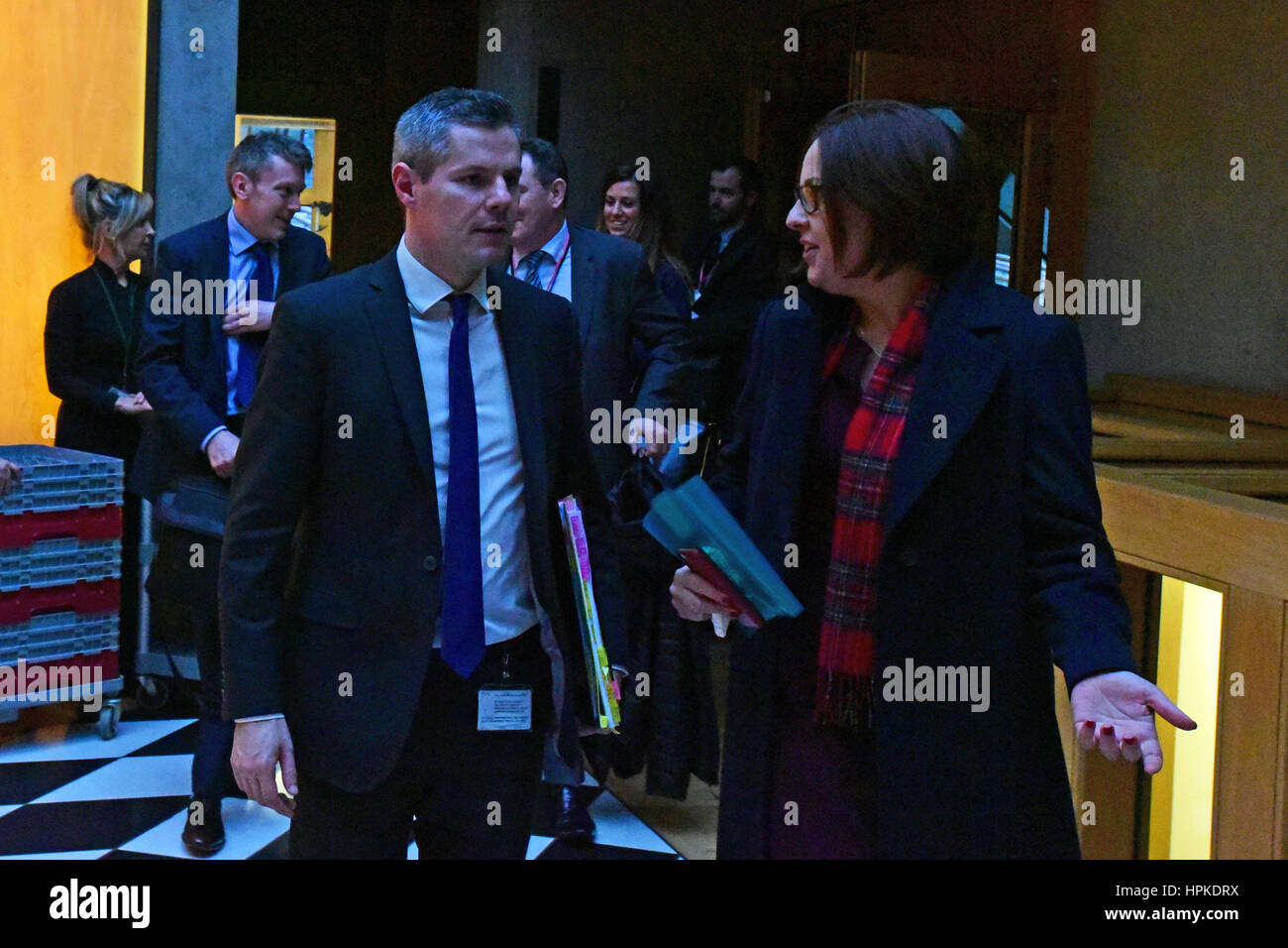 Edinburgh, Scotland, United Kingdom. 23rd February, 2017. Scottish Finance Secretary Derek Mackay chats to Scottish Labour leader Kezia Dugdale as they leave the chamber of the Scottish Parliament folowing the Stage Three debate on the Scottish budget, which the Government won. Credit: Ken Jack/Alamy Live News Stock Photo